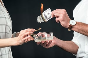 cropped-view-of-businesspeople-burning-dollar-bank-2024-11-17-19-18-46-utc